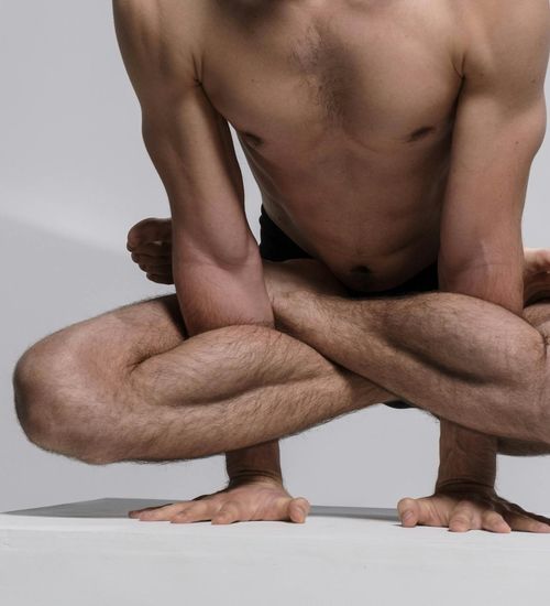 Athlete doing a bodyweight exercise, demonstrating balance and core engagement.